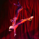 Aerialist practicing after using performance mindset coaching techniques before competition